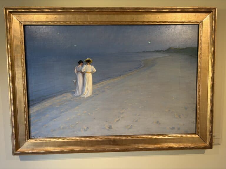 Zwei Frauen am Strand bei Sonnenuntergang, im impressionistischen Stil.